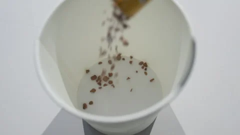 Coffee Grounds or Spices Scattered in White Bowl Closeup Stock Footage 340243675