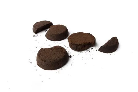 Coffee grounds on white background Stock Photos