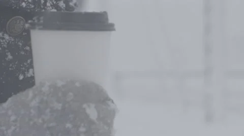 Coffee in hand during a blizzard Stock Footage 61473016