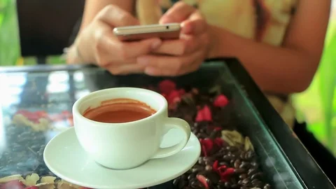 Coffee with hand use mobile phone Stock Footage 85424182