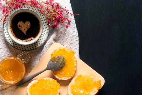Coffee with heart shape and bread with jam Stock Photos