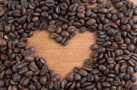 Coffee heart on wooden mat Stock Photos