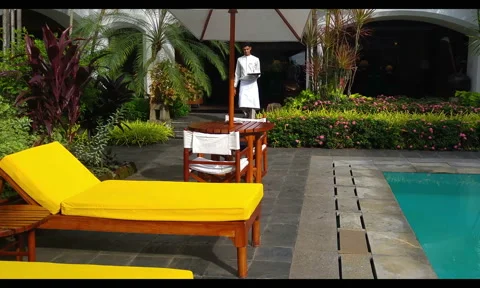 Coffee by the hotel pool 25fps 動画素材 57985350