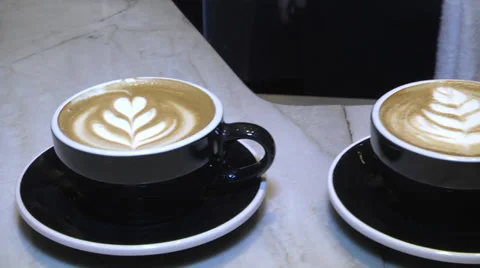 Coffee house latte camera moves  over lattes Stock Footage 32721070