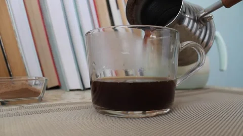 Coffee just brewed is poured into a cup 動画素材 155144846
