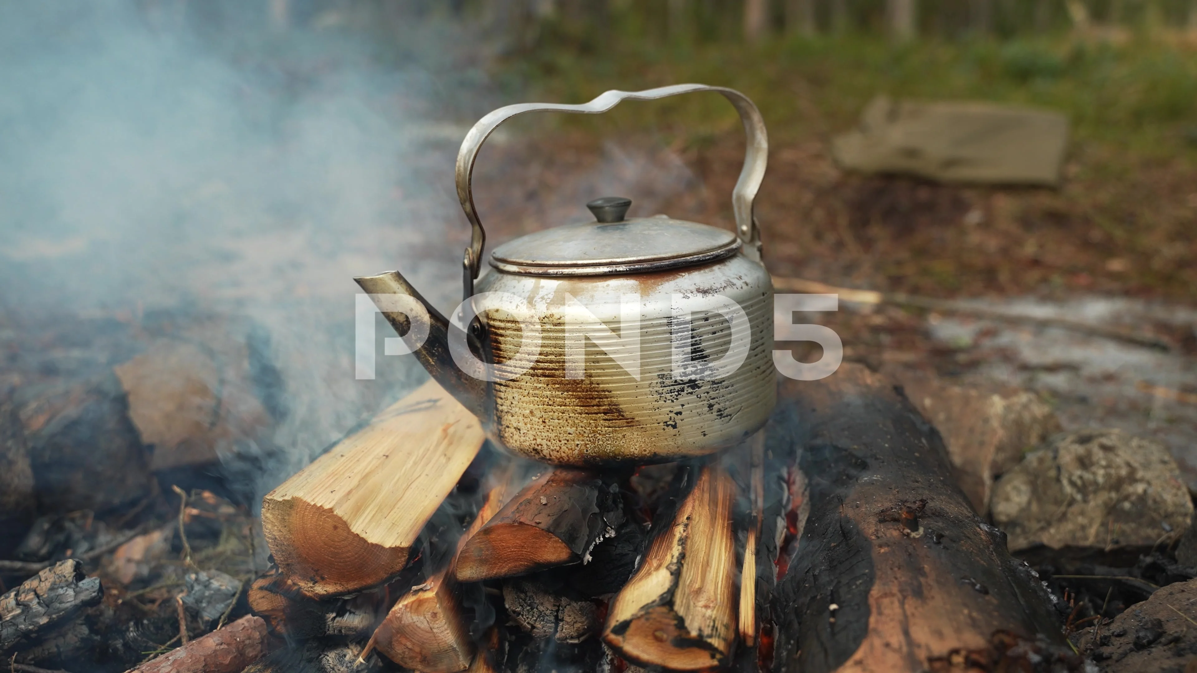 https://images.pond5.com/coffee-kettle-campfire-forest-travel-footage-238007227_prevstill.jpeg