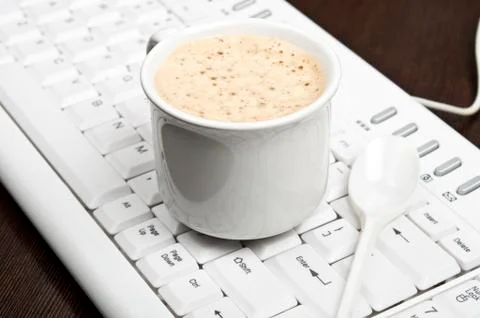 Coffee on keyboard Фото