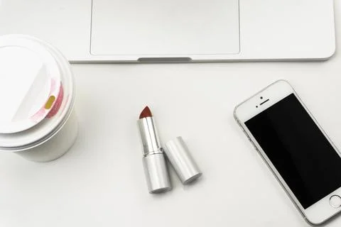 Coffee  laptop computer, notebook and eye glasses,lipsticlk,iphone Stock Photos