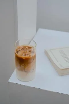 Coffee latte in white table Stock Photos