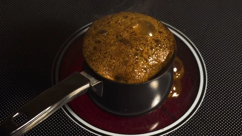 Coffee leaked while being made on a stove Stock Footage 99731614