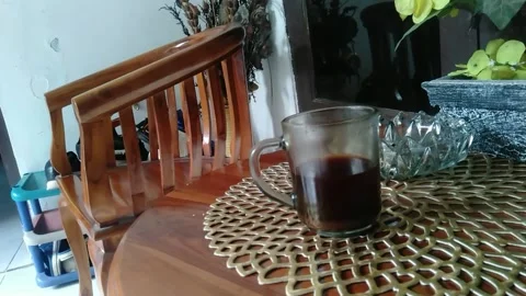 Coffee that is lifted then put back Stock Footage 220592730