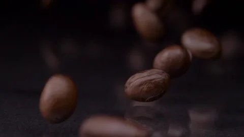 For coffee lover. Slow motion shot of premium fresh roasted brown coffee beans Stock Footage 147413052