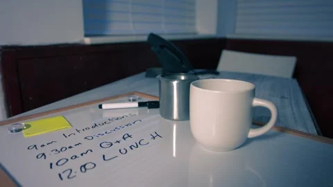Coffee at lunch break at meeting schedule on whiteboard Stock Footage 346720762