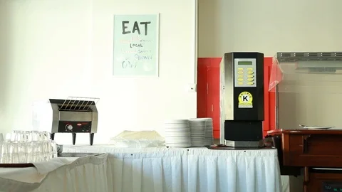 The coffee machine and toastier on table Stock Footage 98990709