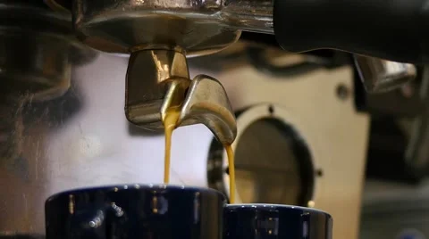 Coffee machine behind the bar - shot of espresso poured into cups Stock Footage 62445956