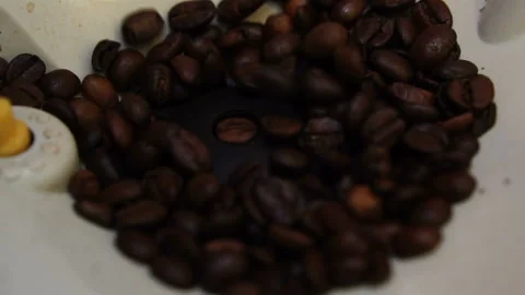 Coffee machine chops fragrant coffee beans for morning coffee, close-up, slow mo 스톡 동영상 112684899