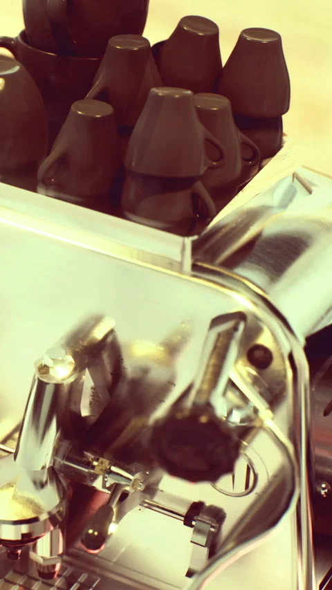 Coffee machine with cups in a cafe setting at a busy time 스톡 동영상 334886560