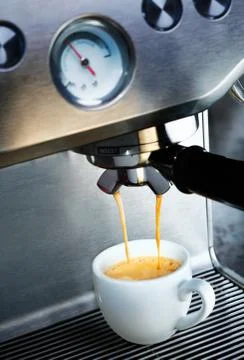 Coffee machine dispensing coffee Stock Photos