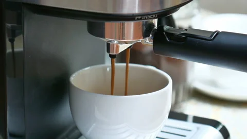 Coffee machine dispensing a cup of delicious hot frothy aromatic coffee int.. Stock Footage 236730334