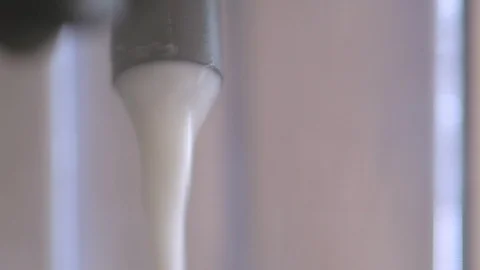 Coffee Machine Dispensing Frothy Milk Close up Stock Footage 124125035