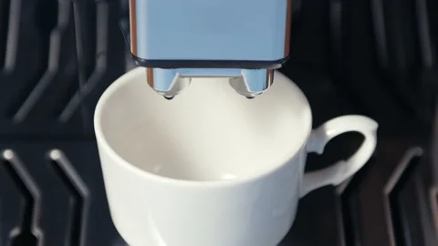 Coffee machine drop a few drops of water in white coffee mug. water scarcity Stock Footage 213314520