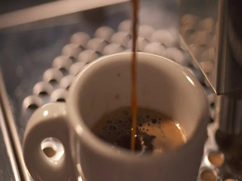 Coffee machine filling a cup with coffee Stock Footage 73683377