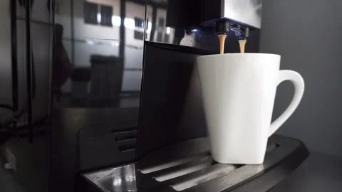 Coffee machine filling a white cup. Espresso drink coming out from an autom.. Stock Footage 230155600