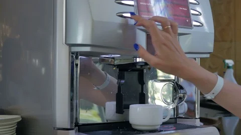 Coffee machine. A girl pours herself a coffee with milk Stock Footage 80325400