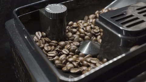 Coffee machine grinds whole grains of coffee Stock Footage 101660964