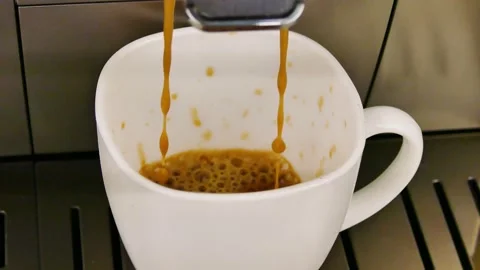 The coffee machine makes coffee in a cup Stock Footage 232327416