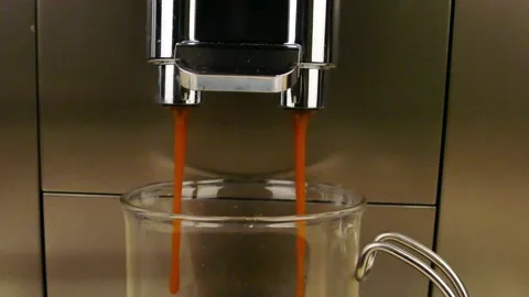 Coffee machine makes coffee in a glass cup Stock Footage 232327409