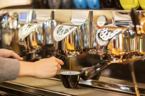 Coffee machine makes two coffee with coffee beans Stock Photos