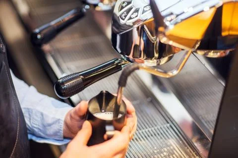 Coffee machine makes two coffee with coffee beans. Stock Photos