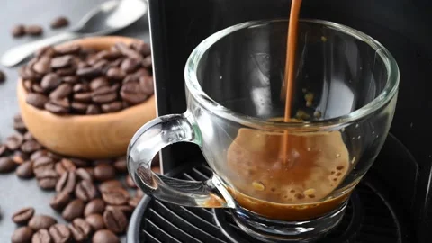 Coffee machine making a creamy espresso in transparent glass cup. Stock Footage 145876480