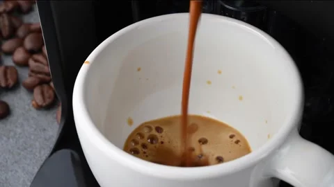 Coffee machine making a creamy espresso in white ceramic cup. Stock Footage 146065702