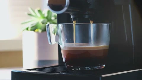 Coffee machine making espresso in glass transparent coffee cup. Stock Footage 151411051