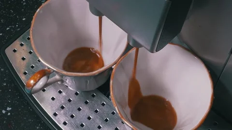 Coffee Machine Making Espresso into a Two Cap Stock Footage 53368768