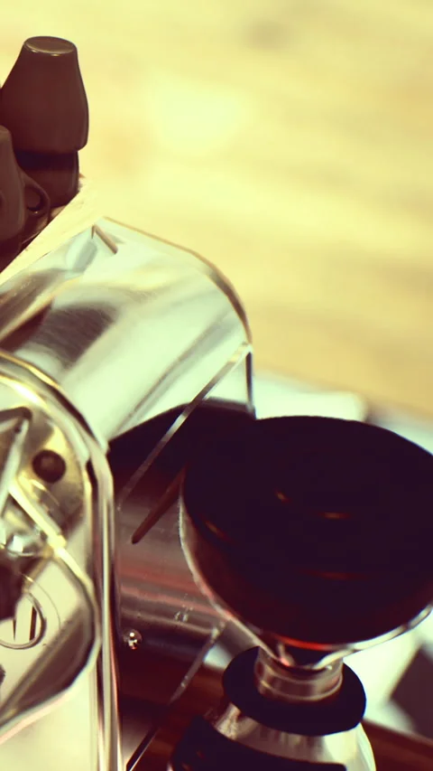 Coffee machine with a portafilter during a brewing process in a café Stock Footage 336013223