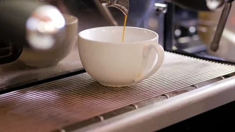 Coffee machine pouring americano in cup. Close up. Stock Footage 106463144