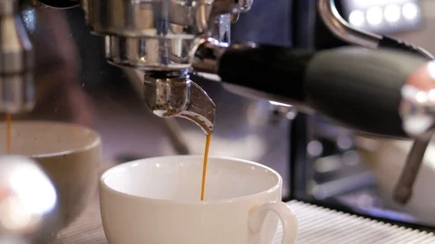 Coffee machine pouring americano in cup. Close up. Stock Footage 106816801