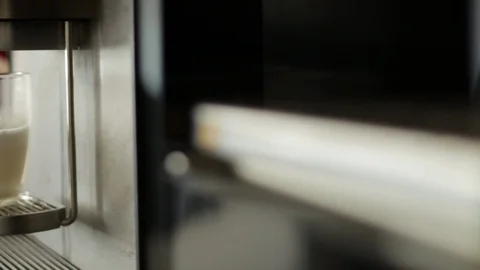 Coffee machine pouring a cafe latte Stock Footage 127850034