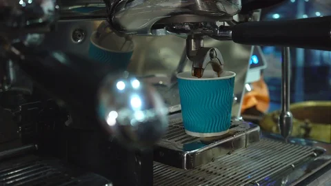 Coffee machine pouring coffee in to the blue paper cup. Stock Footage 88662609
