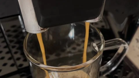 Coffee machine, pouring coffee from the coffee machine into the cup, close up Stock Footage 232873163