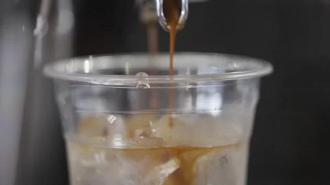 A coffee machine is pouring coffee into a cup Stock Footage 302468201