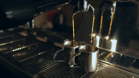 Coffee machine. Pouring coffee into cups close-up Video stock 120467705
