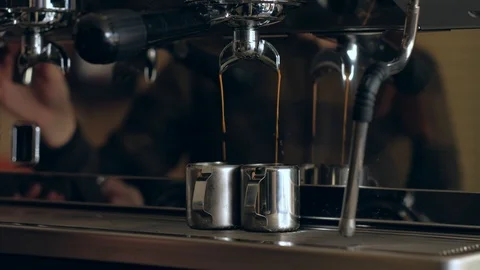 Coffee machine. Pouring coffee into cups close-up Stock Footage 120714777