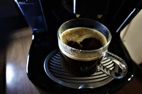 Coffee machine pouring coffee in cups. 스톡 사진