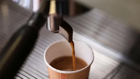 .Coffee machine pouring coffee in to the paper cup.  Stock Footage 74165649