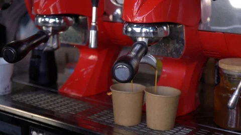 Coffee machine pouring coffee in to the paper cups. Stock Footage 88664806