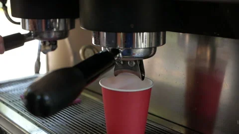 Coffee machine pouring coffee in to the paper cup. Stock Footage 138554494